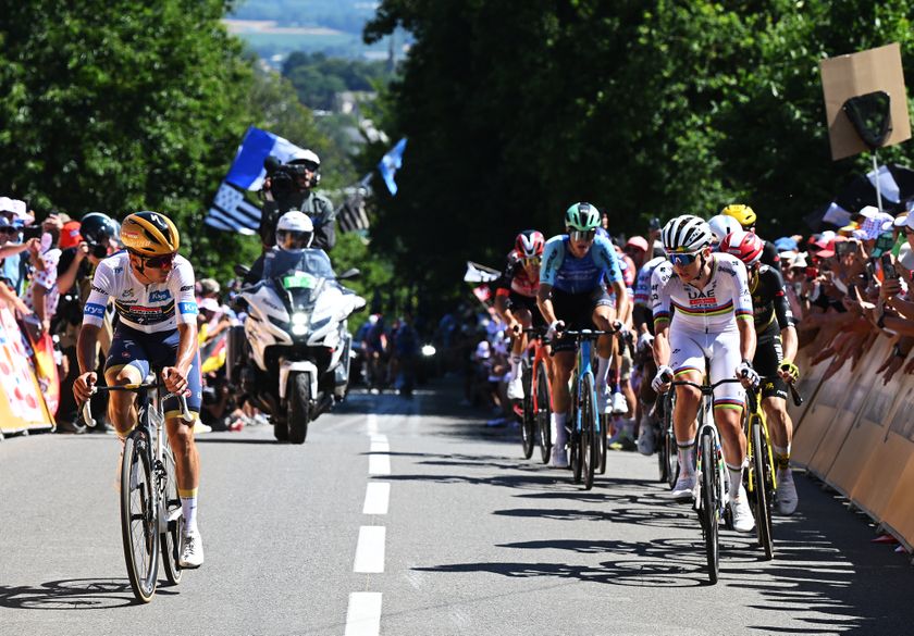 MUR-DE-BRETAGNE - GUERLEDAN, FRANCE - JULY 11: (L-R) Remco Evenepoel of Belgium and Team Soudal Quick-Step - White best Young rider Jersey and Stage winner Tadej Pogacar of Slovenia and UAE Team Emirates - XRG compete climbing the Mur-de-Bretagne during the 112th Tour de France, Stage 7 a 197km stage from Saint-Malo to Mur-de-Bretagne (Guerledan) / #UCIWT / on July 11, 2025 in Saint-Malo, France. (Photo by Dario Belingheri/Getty Images)