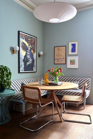 blue dining corner with artwork