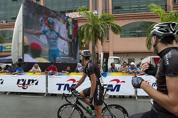 Two New Zealand riders view the stage finish in the hope of their teammate Joseph Cooper being successful. Cooper was in the break and finished in thirteenth place.