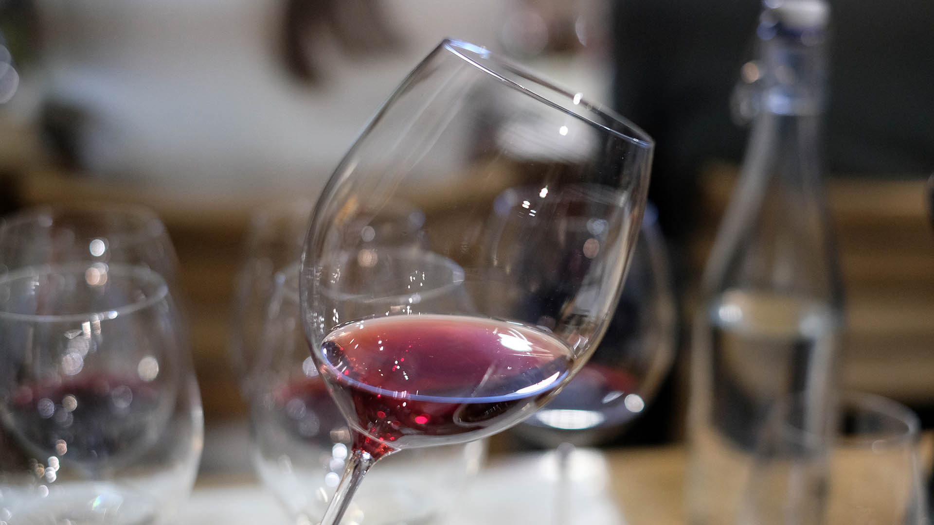 A photo of a glass of red wine.