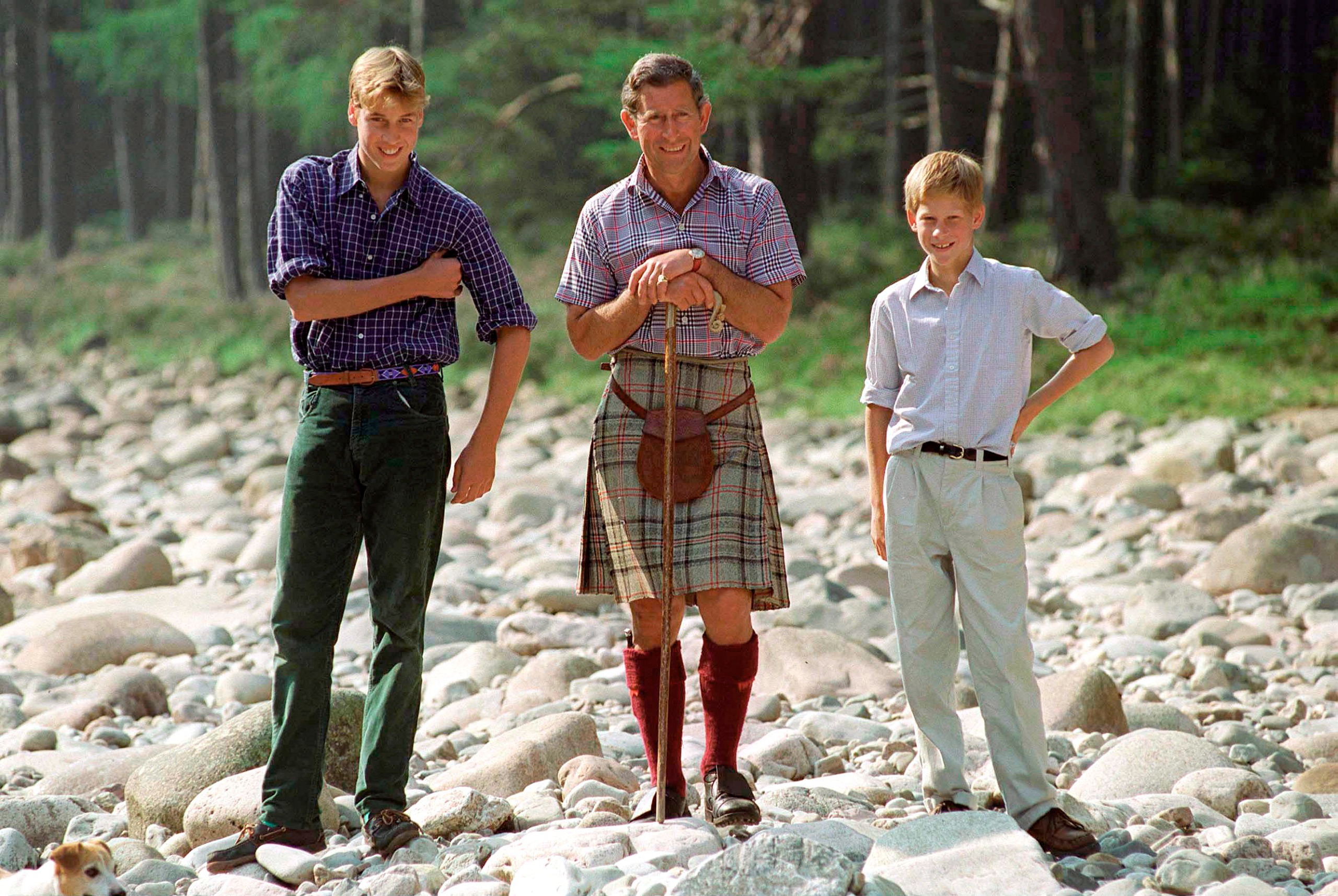Prince William, King Charles and Prince Harry on the rocky beach at Balmoral