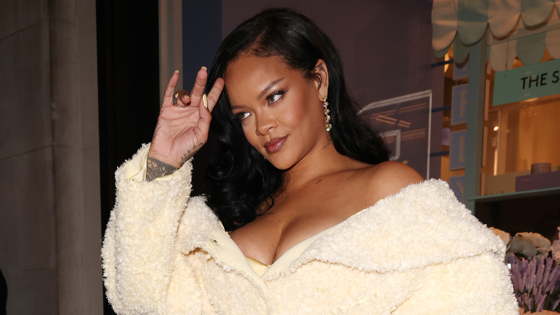 Rihanna pairs a maternity sweatsuit with Puma Speedcat sneakers in lavender