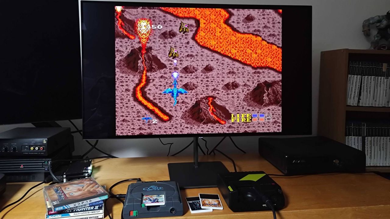 PC Engine running Dragon Spirit next to Hyperkin Retron GX beneath monitor.