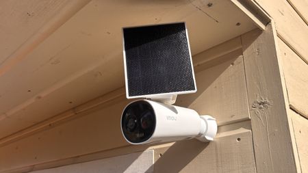 IMOU Cell 3C All-in-One Security Camera mounted outside with solar panel