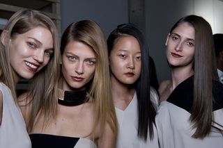 Four models wearing bronzed make-up