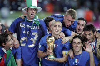 Fabio Cannavaro holds the World Cup trophy during Italy's celebrations in 2006.