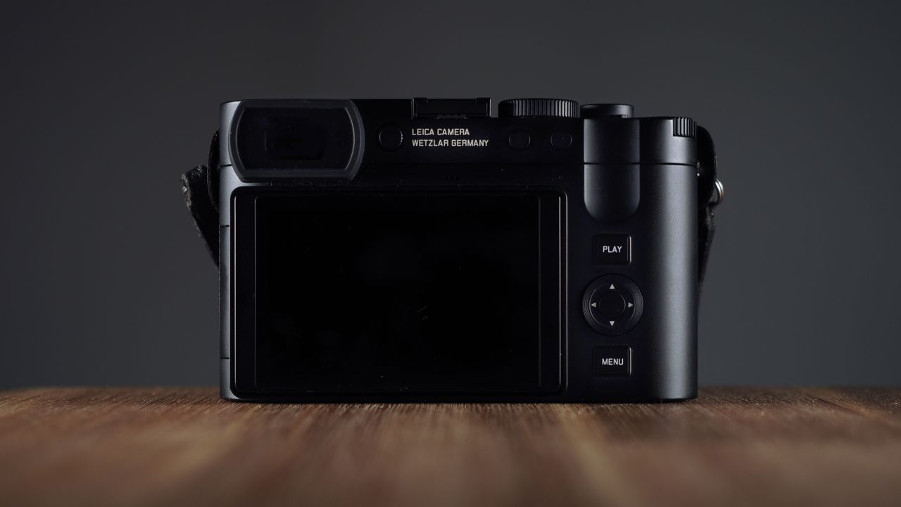 Leica Q3 Monochrom on a wooden surface