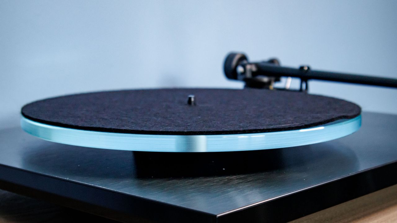 The Rega Planar 3 RS on an entertainment stand.