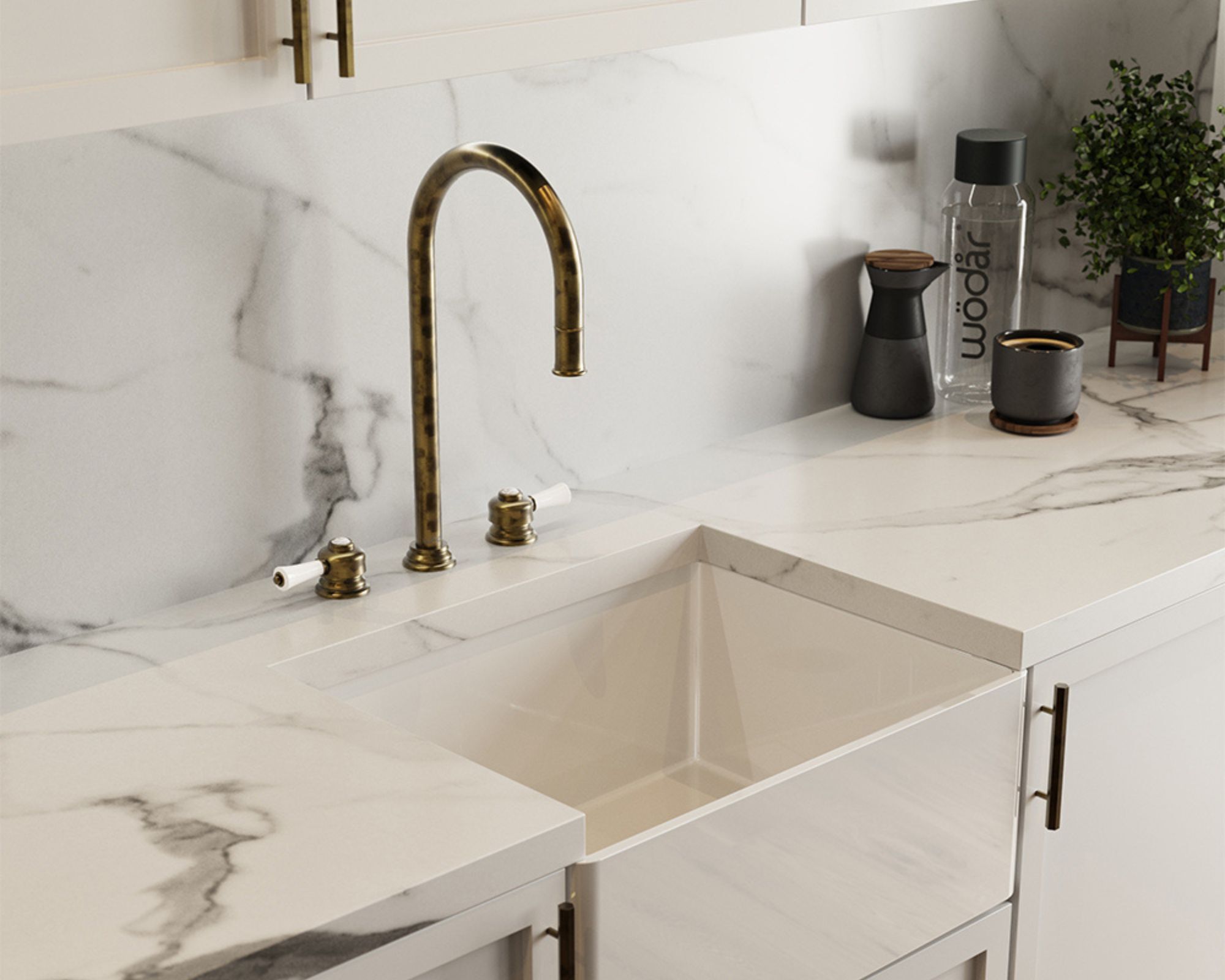 Brass kitchen tap on a marble kitchen worktop