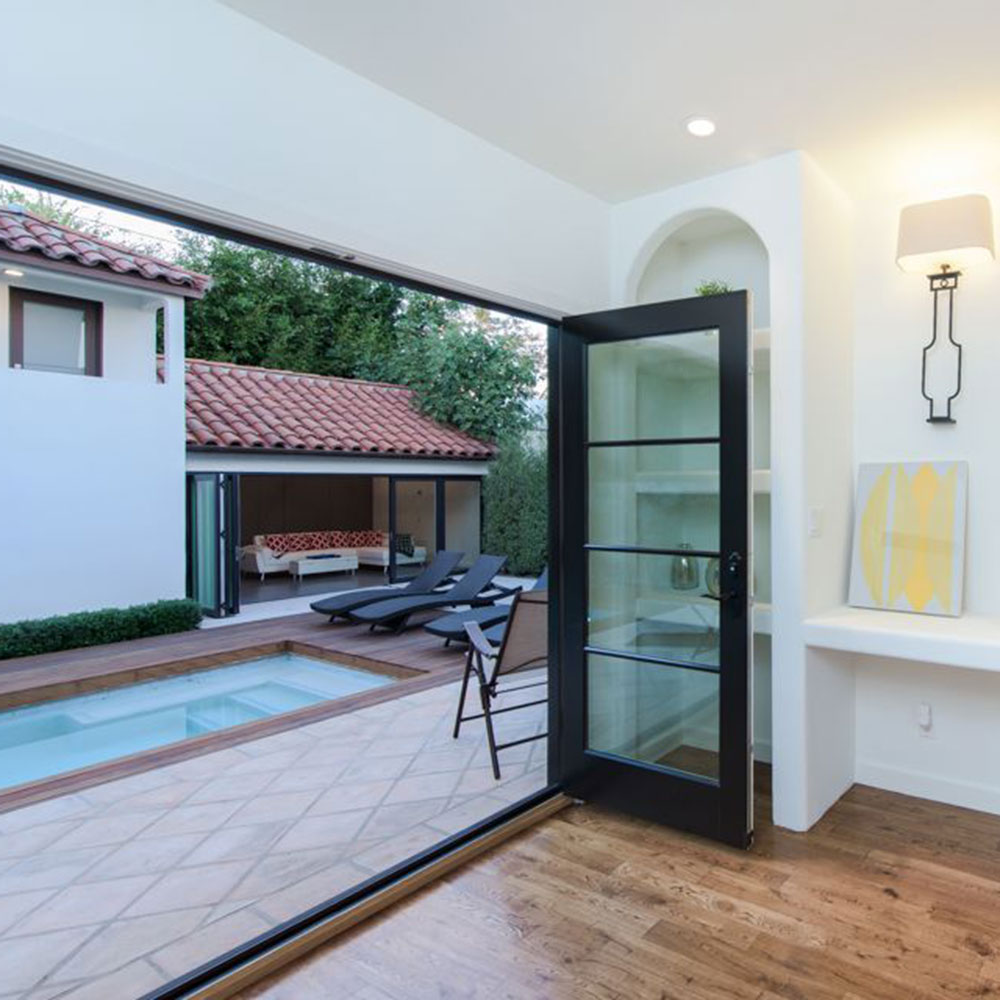 house with swimming pool and poolside chairs