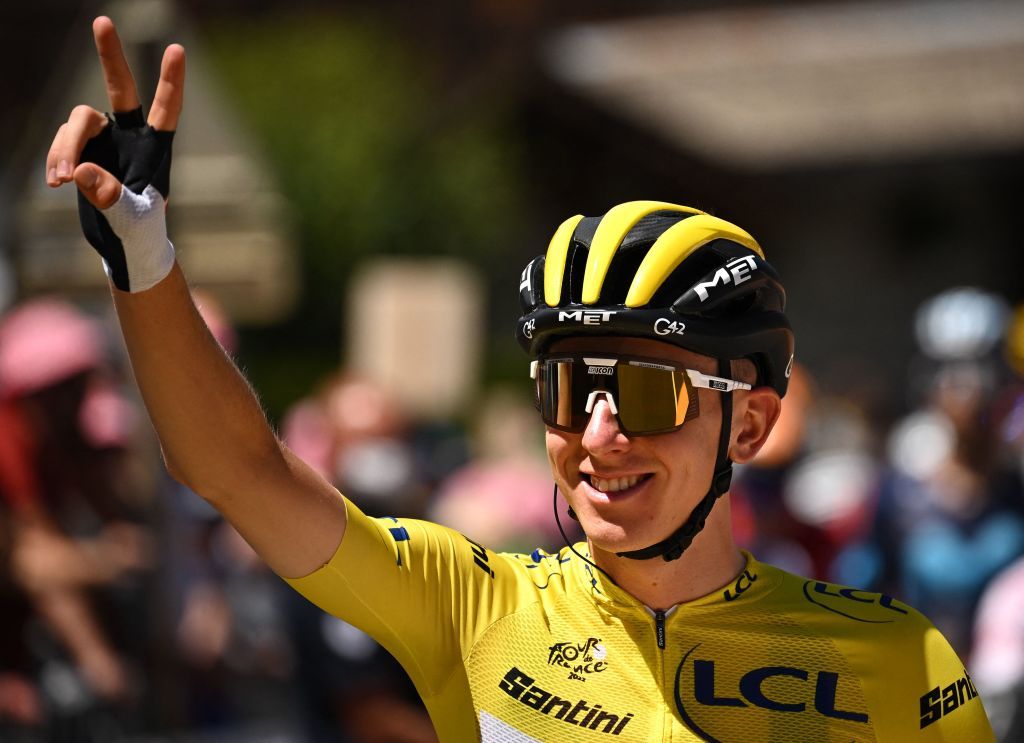 UAE Team Emirates teams Slovenian rider Tadej Pogacar wearing the overall leaders yellow jersey gestures as he awaits the start of the 10th stage of the 109th edition of the Tour de France cycling race 1481 km between Morzine and Megeve in the French Alps on July 12 2022 Photo by Marco BERTORELLO AFP Photo by MARCO BERTORELLOAFP via Getty Images