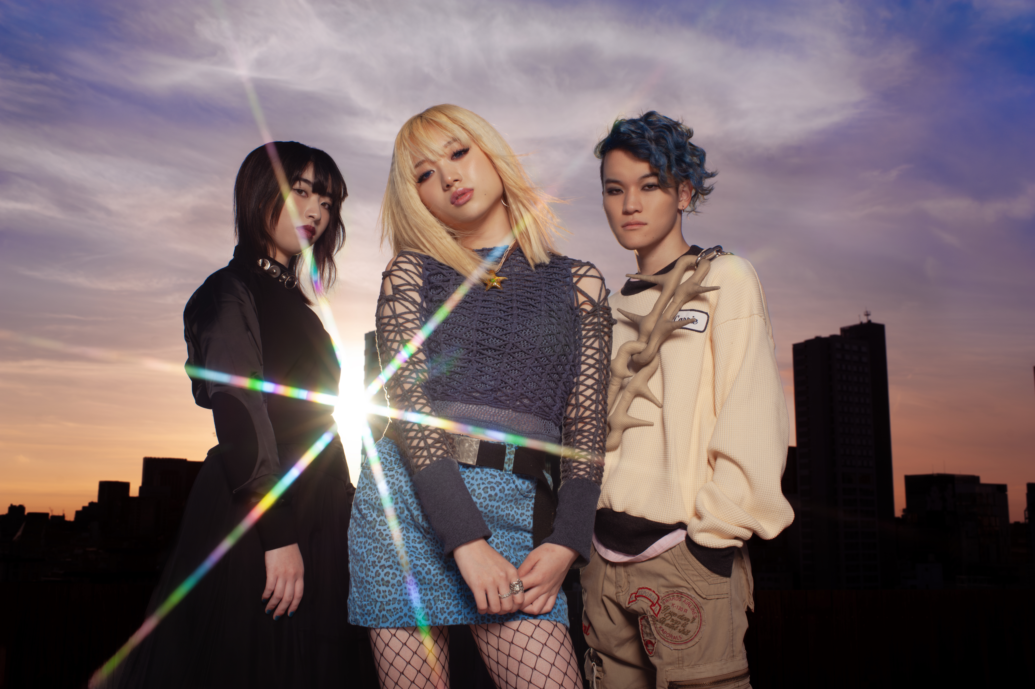 Trio Brandy Senki against a cityscape background