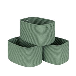 Three woven green storage baskets