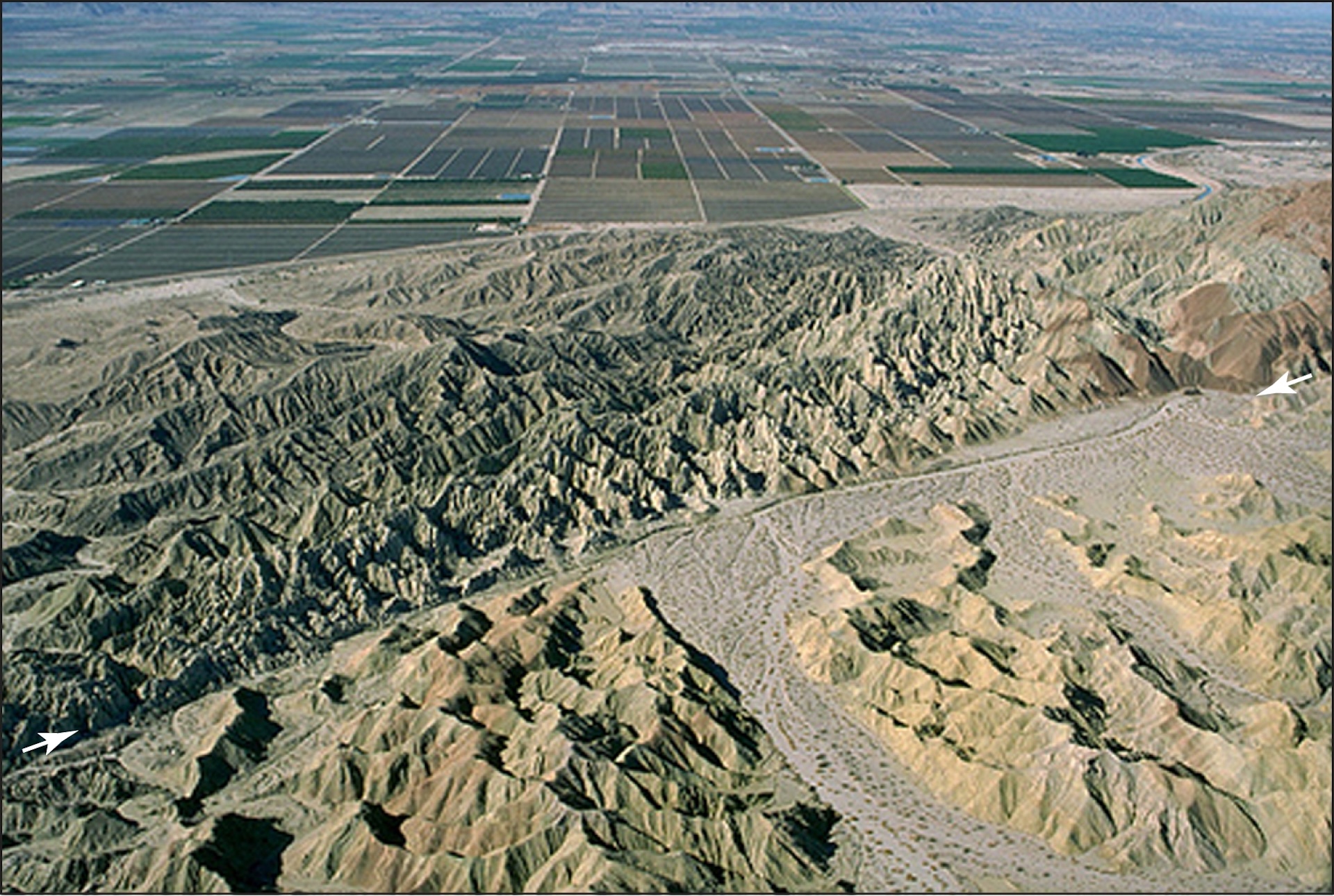 The San Andreas fault appears as a narrow valley between wrinkled brown hills in the Coachella Valley of California.