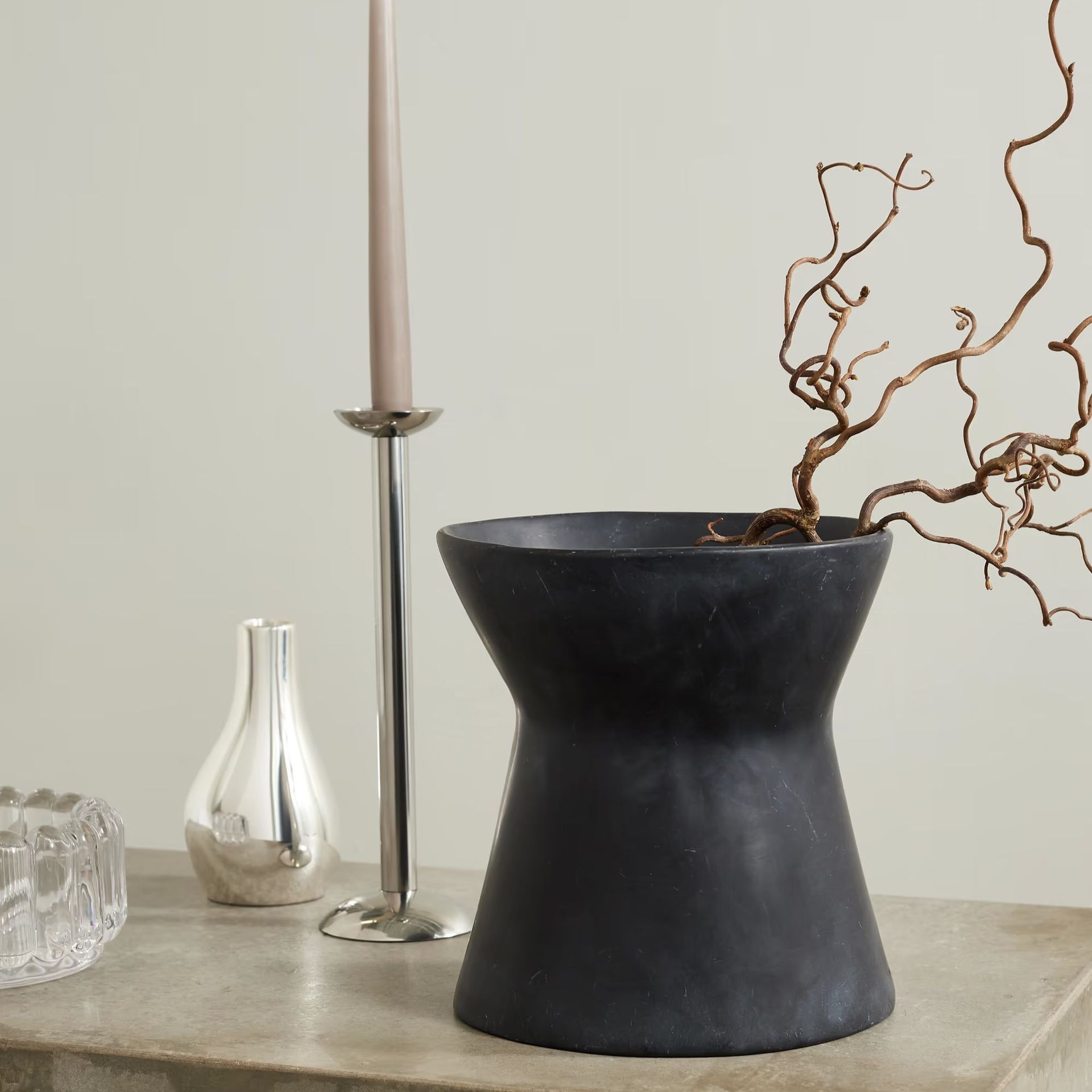 A black sculptural vase from Dinosaur Designs