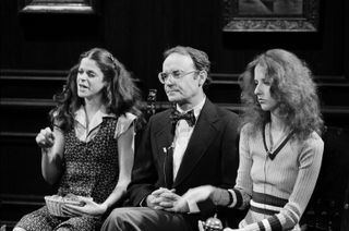 Buck Henry sitting between gilda radner and loraine newman on snl