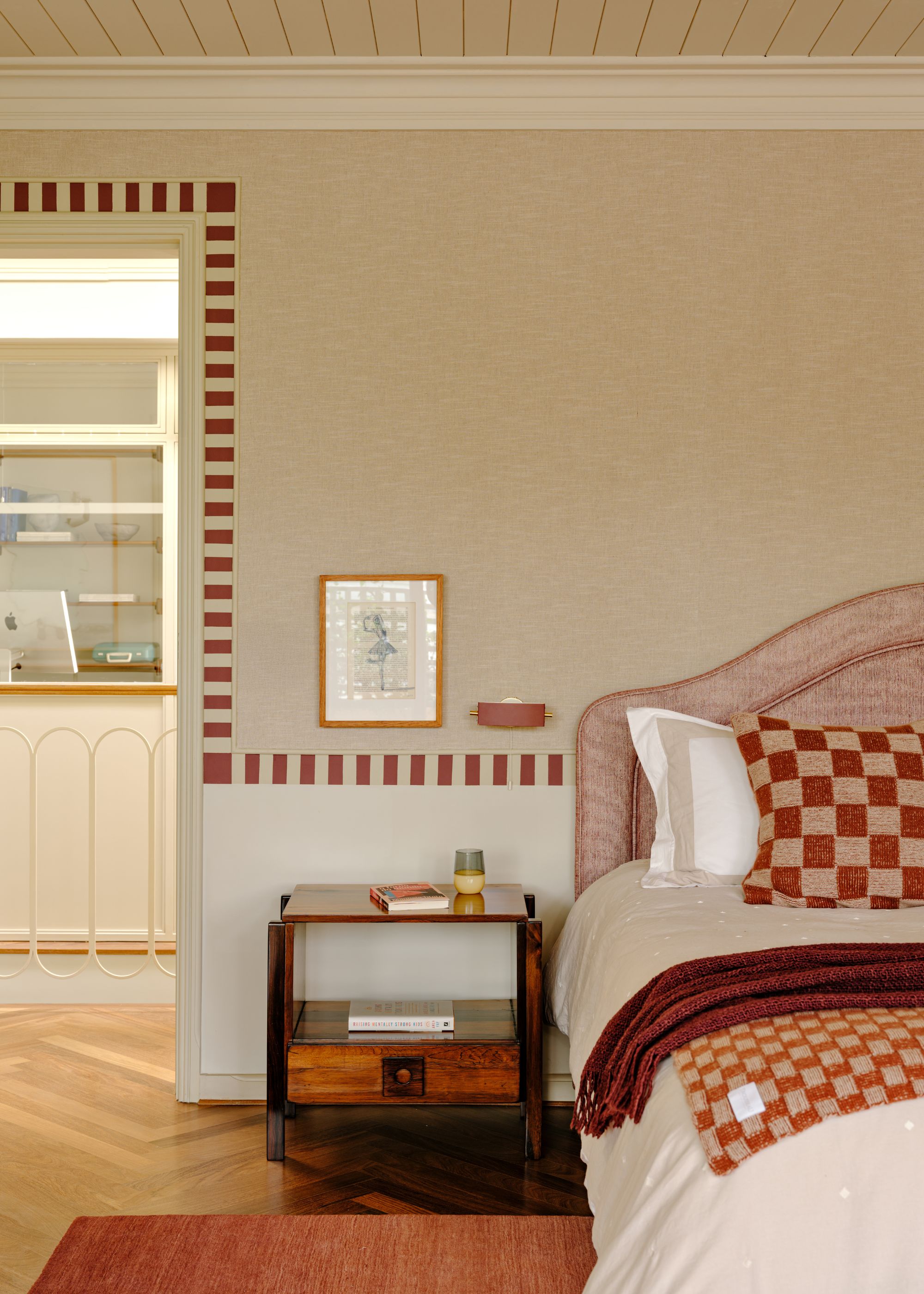 Master bedroom in terracotta tones and an adjoining balcony