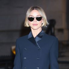 Julianne Hough wearing a navy blazer, blue jeans, and heels