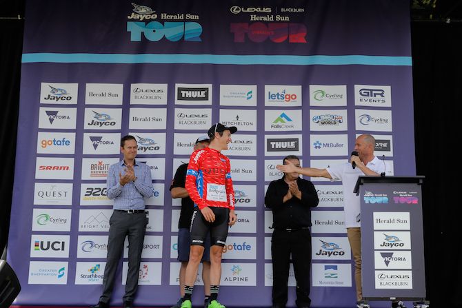 Birthday boy Ben Hill (Team Bridgelane) receives the red jersey as stage 1&rsquo;s most aggressive rider