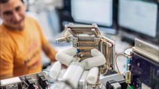 MIRA, Virtual Incision&rsquo;s miniaturized robotic assisted surgery system, is pictured in position to reach rubber bands serving as simulated surgical tissue.