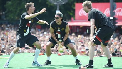 Members of Germany's World Cup winning squad celebrate in Berlin