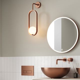 brushed bronze modern wall light with oval shaped frame and globe white light inside