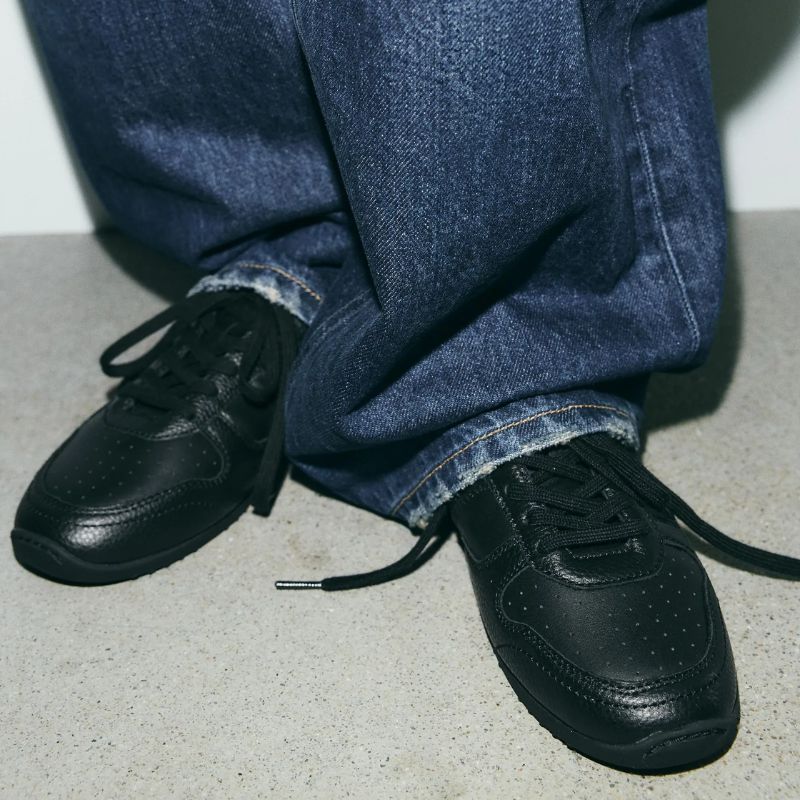 Leather trainers on model