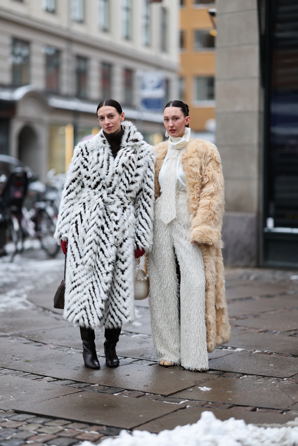 models at copenhagen fashion week wearing fur coats and colorful coats