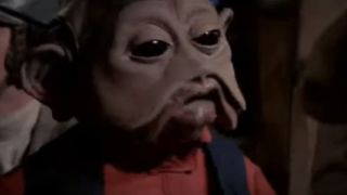 A close up of Nien Nunb with his trademark red shirt