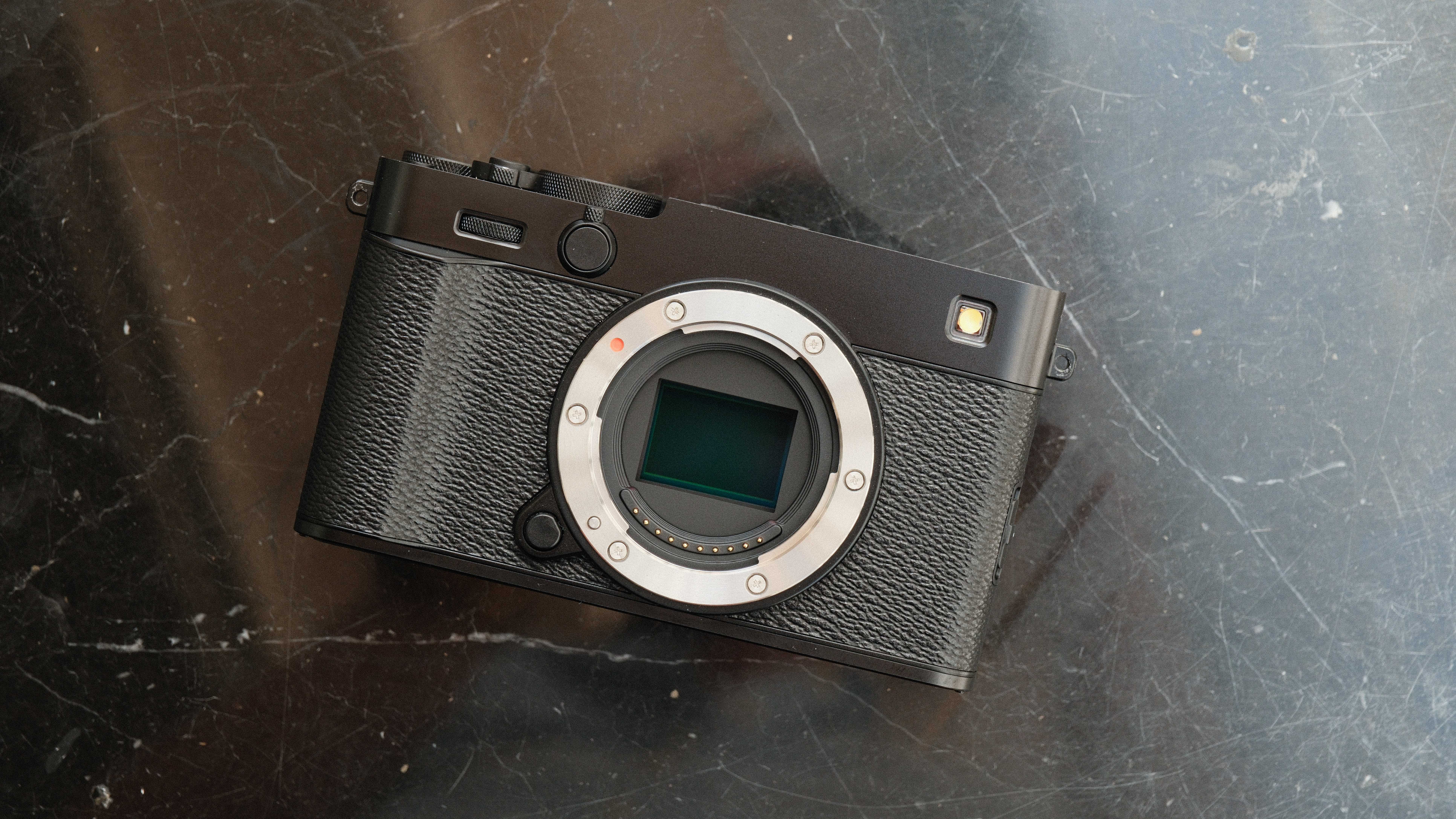 Fujifilm X-E5 camera on a black marble surface