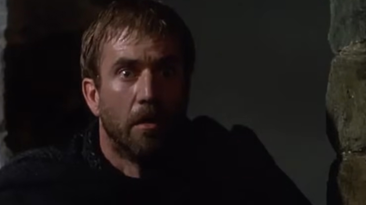 Mel Gibson with light hair and a beard looking surprised in Hamlet