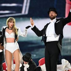 Taylor Swift is joined on stage by Travis Kelce (R), during "Taylor Swift | The Eras Tour" at Wembley Stadium on June 23, 2024 in London, England. 