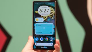 Google Pixel 7a phone showing screens camera and Android 13