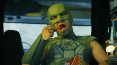 Peacemaker Season 2 – Nhut Le as Judomaster in the back of a van eating Cheetos