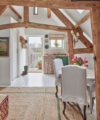 dining area with dining chairs with slipcovers in Sarah Vanrenen Wiltshire country barn