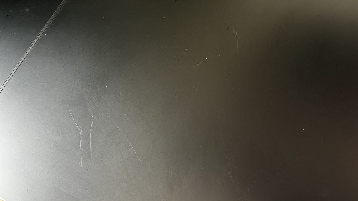 Scratches on the Secretlab Magnus Evo desk.
