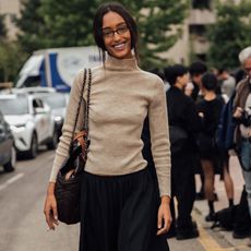 woman wearing turtleneck and skirt 