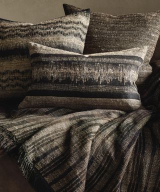Woven blanket and cushions
