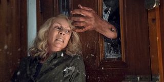 Michael Myers trying to grab Jamie Lee Curtis' Laurie Strode