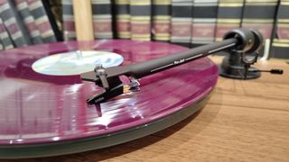 Pro-Ject T1 Evo BT close up tonearm and record