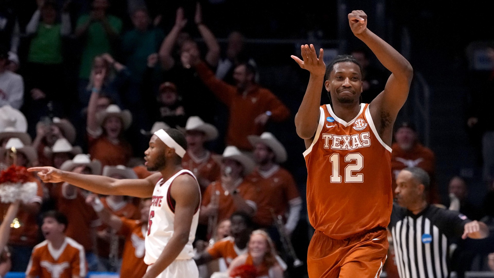 Tramon Mark #12 of the Texas Longhorns celebrates after making the game winning shot against NC State Wolfpack during the second half in the First Four game of March Madness
