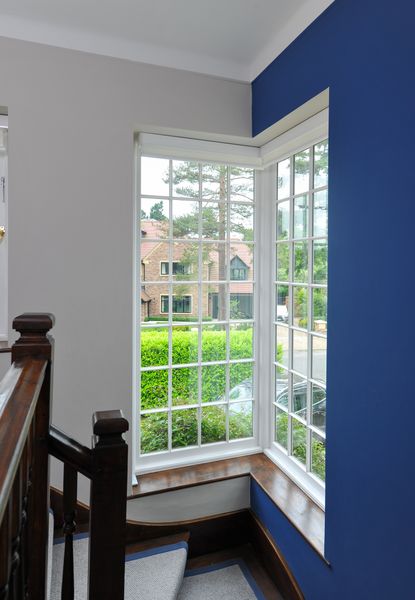 White sash windows in blue hallway