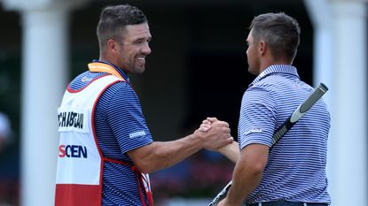 Bryson DeChambeau and his caddie embrace