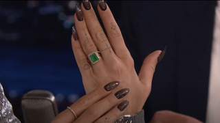 Rita Ora showing her emerald wedding ring on The Tonight Show.