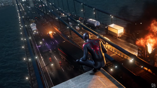 En skärmdump från Marvel's Spider-Man: Miles Morales där spindelmannen sitter uppe på ett hustak i en storstad.