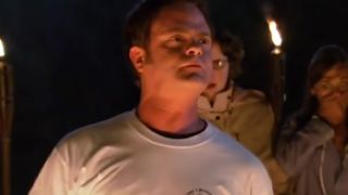 Dwight standing on hot coals