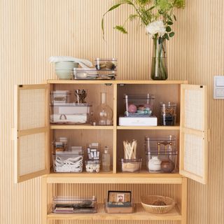 Rattan kitchen cabinets with clear stackable organisers