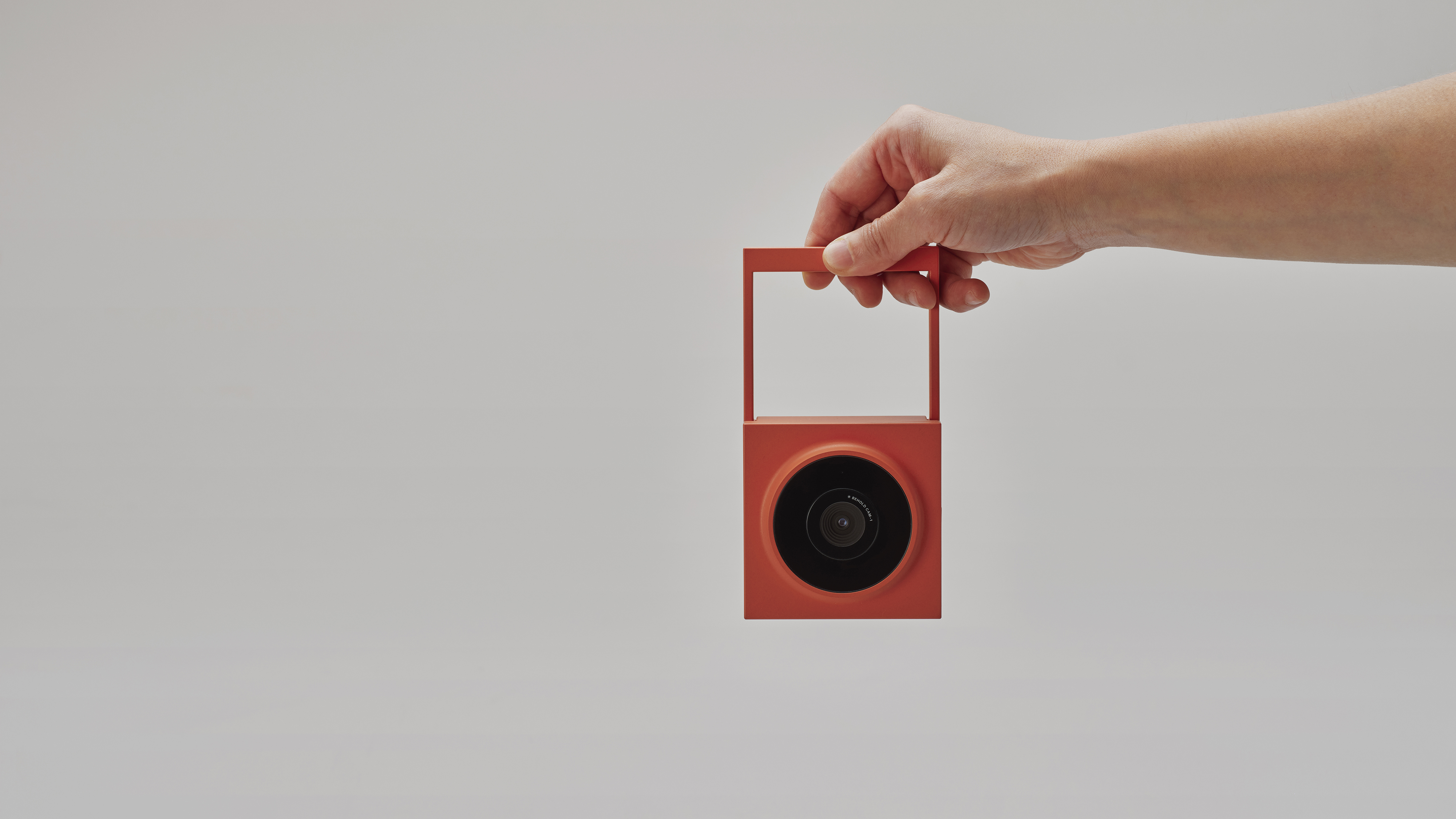 The Behold Cam-1 held in a person's hand