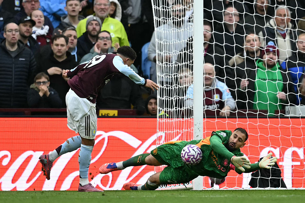 Manchester City's Italian goalkeeper #25 Gianluigi Donnarumma (R) saves a shot from Aston Villa's English defender #19 Jadon Sancho (L) during the English Premier League football match between Aston Villa and Manchester City at Villa Park in Birmingham, central England on October 26, 2025. (Photo by JUSTIN TALLIS / AFP) / RESTRICTED TO EDITORIAL USE. No use with unauthorized audio, video, data, fixture lists, club/league logos or 'live' services. Online in-match use limited to 120 images. An additional 40 images may be used in extra time. No video emulation. Social media in-match use limited to 120 images. An additional 40 images may be used in extra time. No use in betting publications, games or single club/league/player publications. /