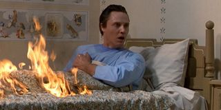 Christopher Walken as Johnny Smith in a burning bed in The Dead Zone